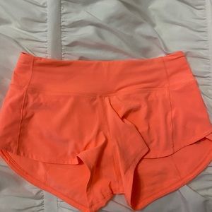 Lululemon rare sunset coral speed up shorts size 2, 2.5 inch inseam.
